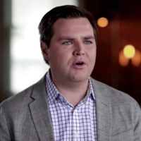 JD Vance looking at a couch catalog