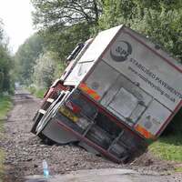 Truck falls into hole it was sent to repair