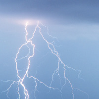 Multi-forked lightning strikes a field