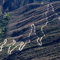 Switchback road curved into the mountainous terrain near Surcubamba, Peru
