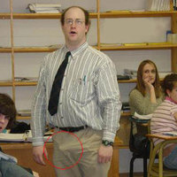 2 Girls behind him but hes pointing it towards the boy?!!