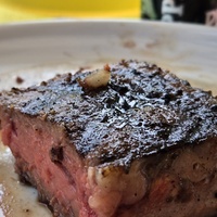 My steak has a tiny chicken on it