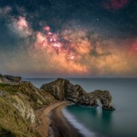 Milky Way rising above Durdle Door in Dorset