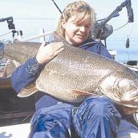 Jeanne Fairbanks of Hibbing holds the 49 pound lake trout she and mom caught