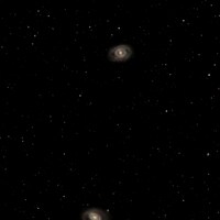 Two spiral galaxies in a star-filled night sky by Steve Busch