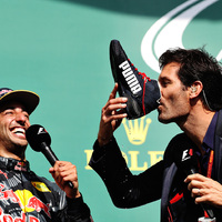 Mark Webber does a shoey from Daniel Ricciardo's race boot