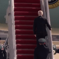 Biden falling up the stairs of Airforce One