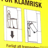 Swedish elevator warning sign