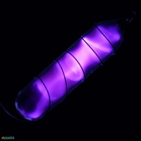 Vial of glowing ultrapure nitrogen, N2. 