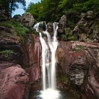 "Red Sandstone Falls — Valle de Pineta, Ordesa" by Bartek M. Wojtkunski