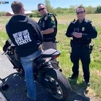 Pulse and DK about to give a ticket to a motorcyclist 