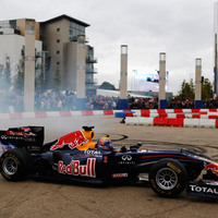 Mark Webber does burnouts in a Red Bull F1 car in Cardiff