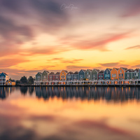 Rainbow houses at sunset by Costas Ganasos