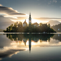 "Lake Bled sunrise reflection" by Nina Lozej