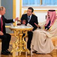 Putin offering guests some tea