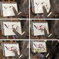 An elephant paints a picture of another elephant