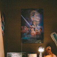 Return of the jedi poster, boombox, and lamp on desk by Georgi Kalaydzhiev