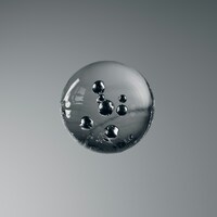 Glass sphere with dark bubbles on a grey background by Rostislav Uzunov