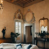 Elegant living room with ornate details and plush sofa by Peter Thomas