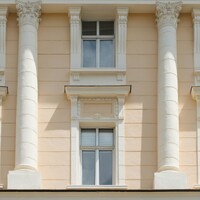 Classical building facade with columns and windows by Pawel Czerwinski