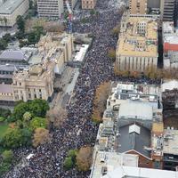 60,000 protest in Melbourne today. No shops looted or arrests made.